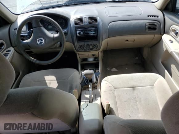 ✅ 2003 Mazda Protege DX • VIN: JM1BJ225630121937 • Лот: 67304315. Опубликован ранее на Copart с пробегом 97 582 миль. Бесплатный доступ к архиву аукционных продаж из США и подробный отчёт об истории автомобиля на DreamBid. Изображение 8.