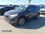 ✅ 2015 Mazda CX-5 Grand Touring • VIN: JM3KE4DY4F0471893 • Lot: 43526634. Wystawiony na IAAI z przebiegiem 159 277 mil. Bezpłatny archiwum sprzedaży aukcyjnych z USA i szczegółowy raport historii pojazdu na DreamBid. Zdjęcie 2.
