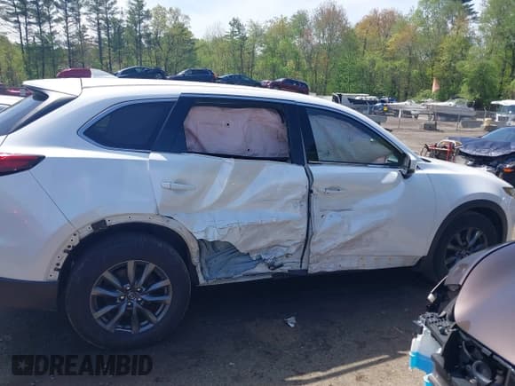 ✅ 2021 Mazda CX-9 Touring • VIN: JM3TCBCYXM0521323 • Lot: 42190976. Listed on IAAI with 56,652 mi. Free auction sales archive from the USA and detailed vehicle history report at DreamBid. Image 13.