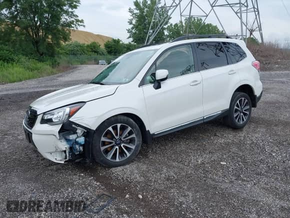 2018 Subaru Forester Touring z VIN JF2SJGWC3JH607000, wystawiony jako IAAI lot #42664722 z przebiegiem 30 857 mil mil oraz . Historia ofert i sprzedaży dostępna na DreamBid. Obrazek 2.