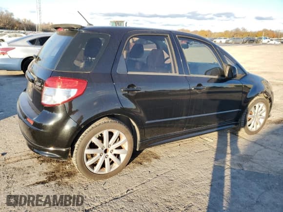 ✅ 2012 Suzuki SX4 Sportback • VIN: JS2YA5A51C6300757 • Лот: 84345314. Опубликован ранее на Copart с пробегом 148 073 миль. Бесплатный доступ к архиву аукционных продаж из США и подробный отчёт об истории автомобиля на DreamBid. Изображение 3.