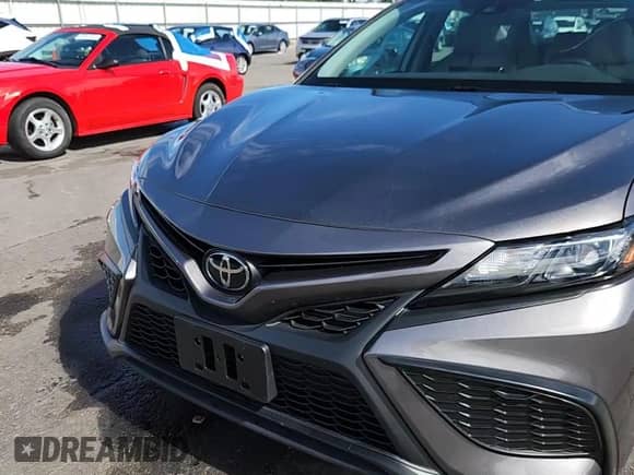 2022 Toyota Camry SE с VIN 4T1G11BK7NU055573, выставлен на аукционе Copart как лот 70327775 с пробегом 19 437 миль миль и Списание • Salvage title. История ставок и продаж доступна на DreamBid. Изображение 13.