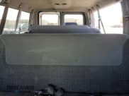 ✅ 1999 Ford Econoline Passenger XL • VIN: 1FBNE31LXXHA06972 • Lot: 65791985. Wystawiony na Copart z przebiegiem 231 201 mil. Bezpłatny archiwum sprzedaży aukcyjnych z USA i szczegółowy raport historii pojazdu na DreamBid. Zdjęcie 10.