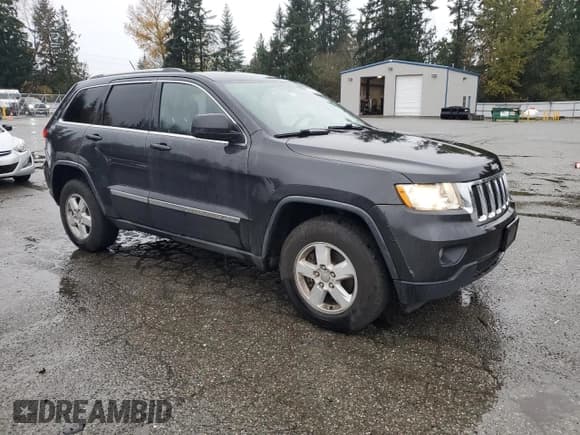 ✅ 2011 Jeep Grand Cherokee Laredo • VIN: 1J4RR4GG9BC705592 • Lot: 93147795. Listed on Copart with 221,481 mi. Free auction sales archive from the USA and detailed vehicle history report at DreamBid. Image 4.