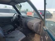 ✅ 1997 Geo Tracker • VIN: 2CNBJ1863V6906951 • Lot: 42400087. Listed on IAAI with 209,563 mi. Free auction sales archive from the USA and detailed vehicle history report at DreamBid. Image 5.