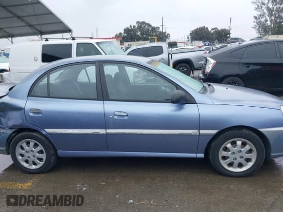✅ 2003 Kia Rio • VIN: KNADC125736223027 • Lot: 41797538. Listed on IAAI with 25,611 mi. Free auction sales archive from the USA and detailed vehicle history report at DreamBid. Image 13.