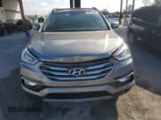 ✅ 2018 Hyundai Santa Fe 2.4L • VIN: 5XYZU3LB3JG556034 • Lot: 90231035. Listed on Copart with 26,542 mi. Free auction sales archive from the USA and detailed vehicle history report at DreamBid. Image 5.
