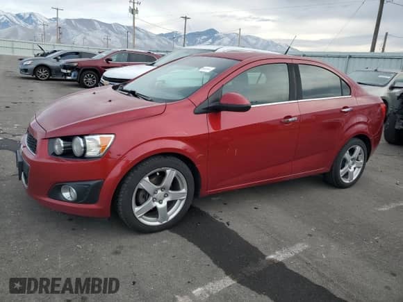 2012 Chevrolet Sonic LTZ z VIN 1G1JE5SBXC4196374, wystawiony jako Copart lot #84453444 z przebiegiem 148 376 mil mil oraz Szkoda całkowita • Salvage title. Historia ofert i sprzedaży dostępna na DreamBid. Obrazek 1.