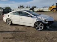 ✅ 2014 Volkswagen CC Executive • VIN: WVWRN7AN3EE513913 • Lot: 82604685. Listed on Copart with 120,862 mi. Free auction sales archive from the USA and detailed vehicle history report at DreamBid. Image 4.