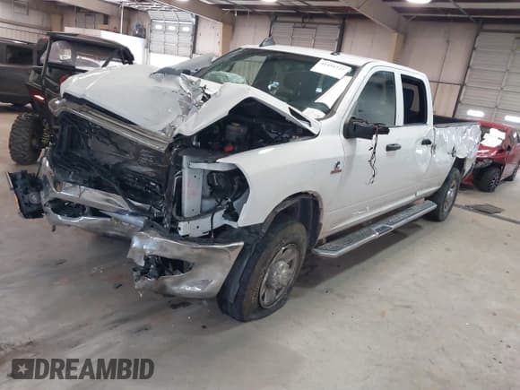 ✅ 2023 Ram 2500 Tradesman • VIN: 3C6UR5HL0PG529660 • Lot: 41491722. Listed on IAAI with 43,672 mi. Free auction sales archive from the USA and detailed vehicle history report at DreamBid. Image 2.
