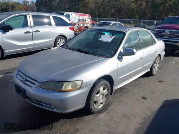 2002 Honda Accord EX с VIN 1HGCG16512A028146, выставлен на аукционе IAAI как лот 43554658 с пробегом 141 372 миль миль и . История ставок и продаж доступна на DreamBid. Изображение 2.
