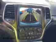 2018 Jeep Grand Cherokee Sterling z VIN 1C4RJFBGXJC267146, wystawiony jako IAAI lot #43411533 z przebiegiem 58 843 mil mil oraz . Historia ofert i sprzedaży dostępna na DreamBid. Obrazek 18.