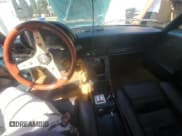 ✅ 1989 Alfa Romeo Spider • VIN: ZARBA5587K1066209 • Lot: 77166704. Wystawiony na Copart z przebiegiem 98 255 mil. Bezpłatny archiwum sprzedaży aukcyjnych z USA i szczegółowy raport historii pojazdu na DreamBid. Zdjęcie 9.