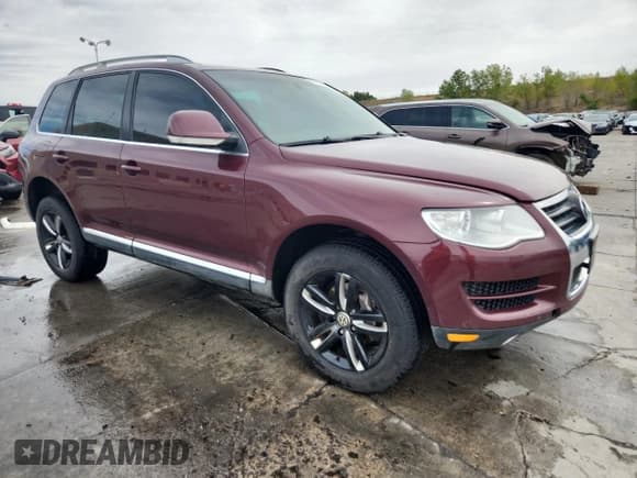 ✅ 2010 Volkswagen Touareg V6 • VIN: WVGFK7A93AD001661 • Lot: 81596405. Listed on Copart with 124,220 mi. Free auction sales archive from the USA and detailed vehicle history report at DreamBid. Image 4.
