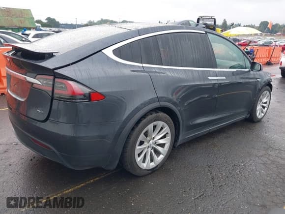✅ 2016 Tesla Model X 70D • VIN: 5YJXCBE29GF019542 • Lot: 43453345. Listed on IAAI with 127,876 mi. Free auction sales archive from the USA and detailed vehicle history report at DreamBid. Image 4.