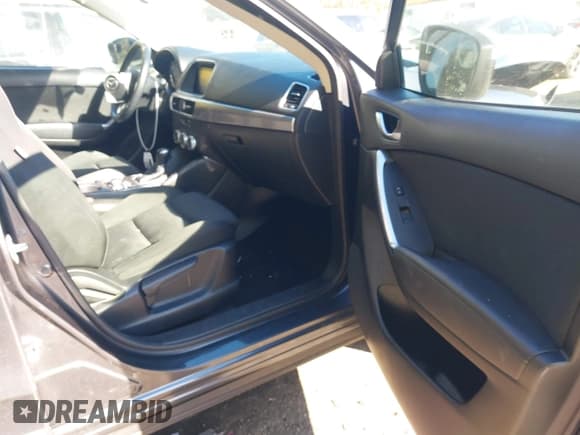 ✅ 2016 Mazda CX-5 Touring • VIN: JM3KE4CY5G0716056 • Lot: 43521281. Listed on IAAI with 107,968 mi. Free auction sales archive from the USA and detailed vehicle history report at DreamBid. Image 5.