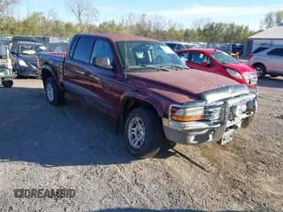 2002 Dodge Dakota SLT with VIN 1B7HG48N82S552357, listed as a IAAI auction lot 43498260 with 192,220 mi miles and . Bid and sale history available at DreamBid. Image 1.