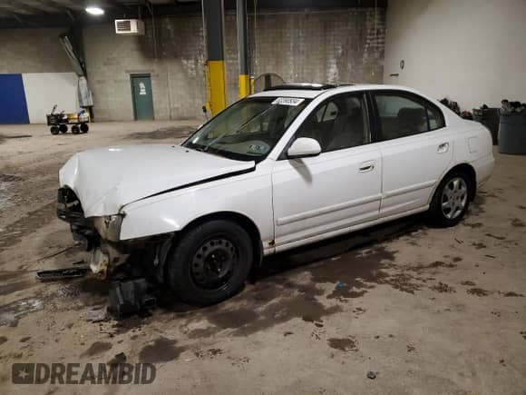 2003 Hyundai Elantra GLS z VIN KMHDN45D23U489919, wystawiony jako Copart lot #83390934 z przebiegiem Nie podano mil oraz Szkoda całkowita • Salvage title. Historia ofert i sprzedaży dostępna na DreamBid. Obrazek 1.