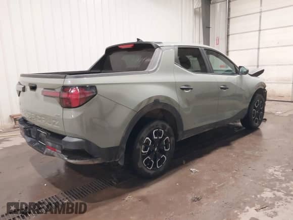 2024 Hyundai Santa Cruz SE with VIN 5NTJADDE7RH108941, listed as a IAAI auction lot 40990254 with 7,461 mi miles and . Bid and sale history available at DreamBid. Image 4.