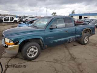 1999 Dodge Dakota SLT z VIN 1B7GG22Y5XS119136, wystawiony jako Copart lot #79797774 z przebiegiem 278 120 mil mil oraz Czysty tytuł • Clean title. Historia ofert i sprzedaży dostępna na DreamBid. Obrazek 1.