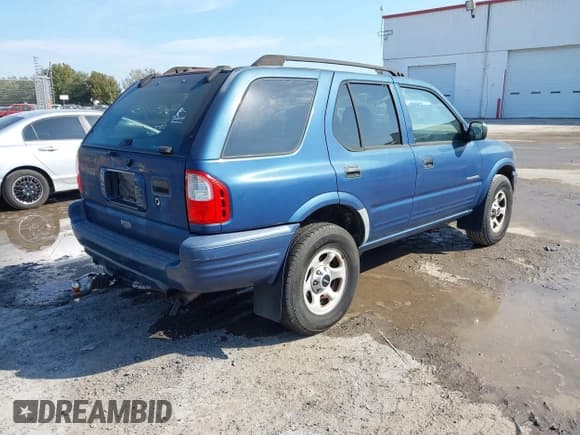 ✅ 2004 Isuzu Rodeo S • VIN: 4S2CK58W944317209 • Lot: 41498160. Listed on IAAI with 114,764 mi. Free auction sales archive from the USA and detailed vehicle history report at DreamBid. Image 4.
