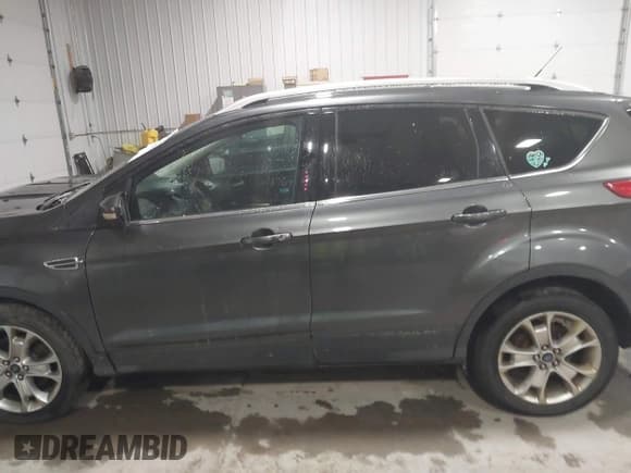 ✅ 2015 Ford Escape Titanium • VIN: 1FMCU9JX5FUA35888 • Lot: 41209408. Listed on IAAI with 125,378 mi. Free auction sales archive from the USA and detailed vehicle history report at DreamBid. Image 14.