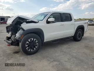 2023 Nissan Frontier Pro-X with VIN 1N6ED1EJ6PN661933, listed as a Copart auction lot 52496135 with 28,533 mi miles and Salvage title. Bid and sale history available at DreamBid. Image 1.