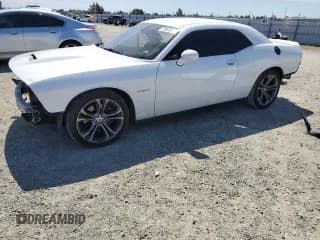 ✅ 2021 Dodge Challenger R/T • VIN: 2C3CDZBT0MH526521 • Lot: 57964035. Listed on Copart with 99,671 mi. Free auction sales archive from the USA and detailed vehicle history report at DreamBid. Image 1.