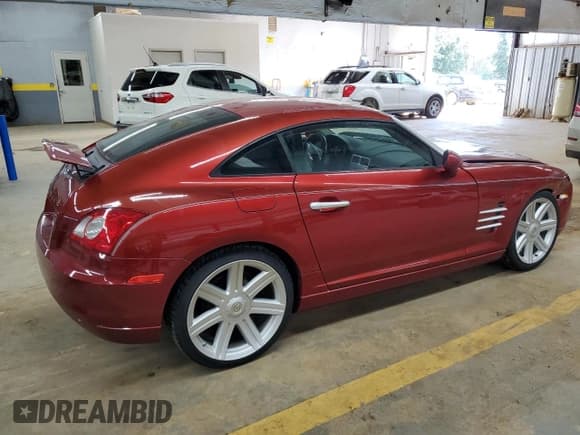 ✅ 2004 Chrysler Crossfire • VIN: 1C3AN69L64X016159 • Lot: 73924774. Listed on Copart with 106,570 mi. Free auction sales archive from the USA and detailed vehicle history report at DreamBid. Image 3.