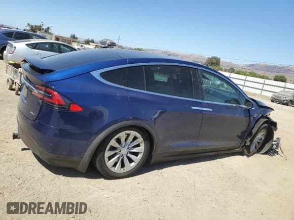 ✅ 2018 Tesla Model X 75D • VIN: 5YJXCBE23JF103458 • Лот: 69646965. Опубликован ранее на Copart с пробегом 99 232 миль. Бесплатный доступ к архиву аукционных продаж из США и подробный отчёт об истории автомобиля на DreamBid. Изображение 3.