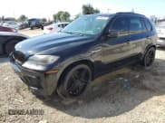✅ 2012 BMW X5 M • VIN: 5YMGY0C51CLK27349 • Lot: 81960915. Listed on Copart with 103,265 mi. Free auction sales archive from the USA and detailed vehicle history report at DreamBid. Image 1.