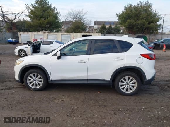✅ 2013 Mazda CX-5 Touring • VIN: JM3KE2CEXD0148702 • Lot: 43877352. Listed on IAAI with 183,342 mi. Free auction sales archive from the USA and detailed vehicle history report at DreamBid. Image 14.