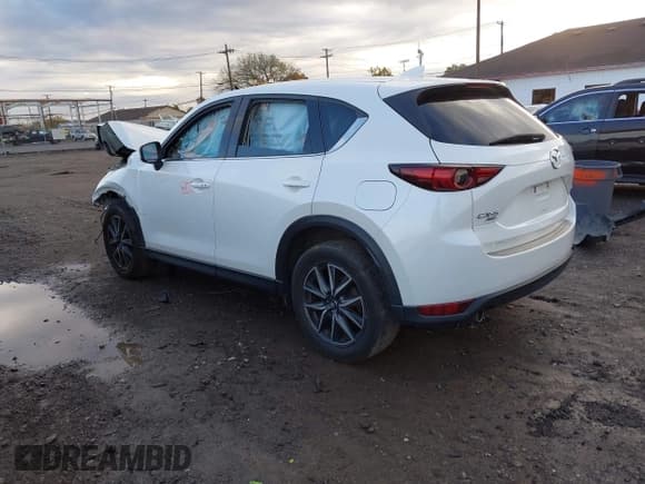✅ 2018 Mazda CX-5 Grand Touring • VIN: JM3KFBDM2J0441881 • Lot: 43526832. Listed on IAAI with 104,567 mi. Free auction sales archive from the USA and detailed vehicle history report at DreamBid. Image 3.