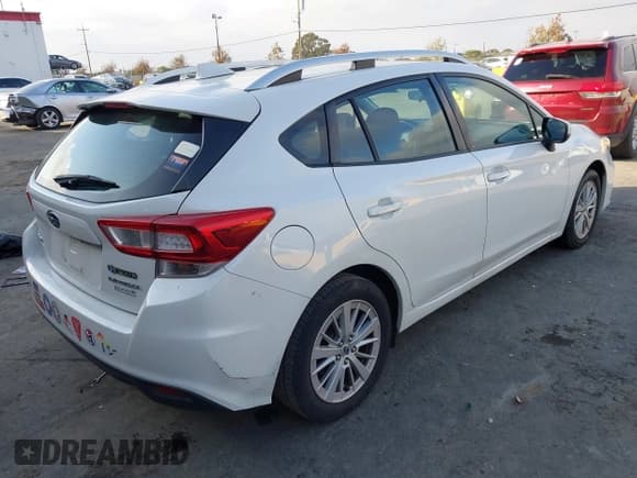 ✅ 2017 Subaru Impreza Premium • VIN: 4S3GTAD69H3719297 • Lot: 43799712. Listed on IAAI with 96,375 mi. Free auction sales archive from the USA and detailed vehicle history report at DreamBid. Image 4.