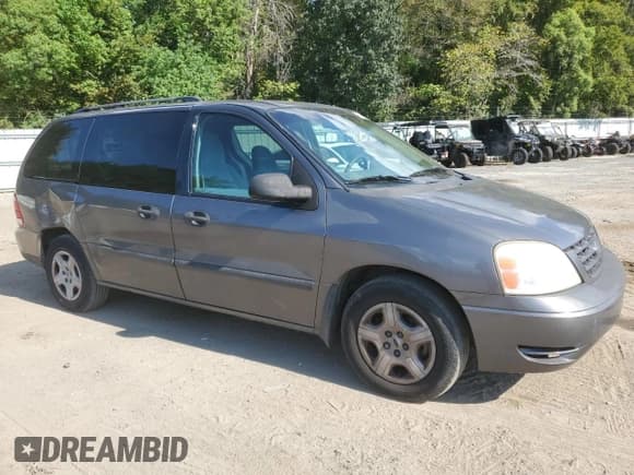 ✅ 2005 Ford Freestar SE • VIN: 2FMZA51665BA45949 • Lot: 72381804. Listed on Copart with 121,518 mi. Free auction sales archive from the USA and detailed vehicle history report at DreamBid. Image 4.