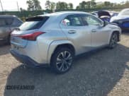 ✅ 2023 Lexus UX 250h Premium • VIN: JTHP9JBH7P2064515 • Lot: 43382117. Listed on IAAI with 32,348 mi. Free auction sales archive from the USA and detailed vehicle history report at DreamBid. Image 4.