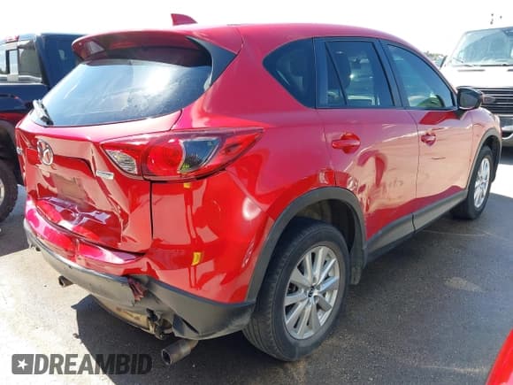 ✅ 2015 Mazda CX-5 Touring • VIN: JM3KE2CY2F0510101 • Lot: 43273950. Listed on IAAI with 128,283 mi. Free auction sales archive from the USA and detailed vehicle history report at DreamBid. Image 4.