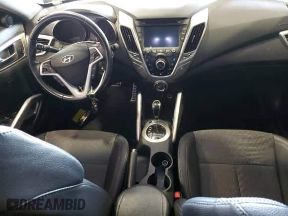 2015 Hyundai Veloster z VIN KMHTC6AD0FU236993, wystawiony jako Copart lot #62411173 z przebiegiem 83 612 mil mil oraz . Historia ofert i sprzedaży dostępna na DreamBid. Obrazek 8.