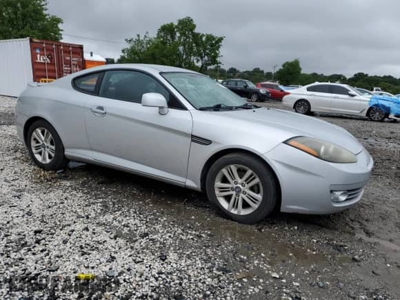 2008 Hyundai Tiburon GS с VIN KMHHM66D68U288062, выставлен на аукционе Copart как лот 58261695 с пробегом 130 310 миль миль и Чистый • Clean title. История ставок и продаж доступна на DreamBid. Изображение 4.