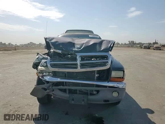 2001 Dodge Dakota Sport z VIN 1B7GG26N81S262671, wystawiony jako Copart lot #71080995 z przebiegiem 145 480 mil mil oraz Szkoda całkowita • Salvage title. Historia ofert i sprzedaży dostępna na DreamBid. Obrazek 13.