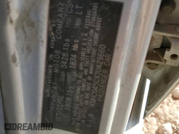 2003 Hyundai Accent GL z VIN KMHCG45CX3U429660, wystawiony jako Copart lot #43824125 z przebiegiem Nie podano mil oraz Szkoda całkowita • Salvage title. Historia ofert i sprzedaży dostępna na DreamBid. Obrazek 13.