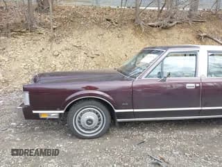 ✅ 1987 Lincoln Town Car • VIN: 1LNBM81F5HY704217 • Lot: 41855678. Listed on IAAI with 86,794 mi. Free auction sales archive from the USA and detailed vehicle history report at DreamBid. Image 6.