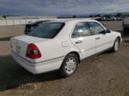 ✅ 1995 Mercedes-Benz C 2.8L • VIN: WDBHA28E1SF151911 • Лот: 76814424. Опубликован ранее на Copart с пробегом 128 184 миль. Бесплатный доступ к архиву аукционных продаж из США и подробный отчёт об истории автомобиля на DreamBid. Изображение 3.