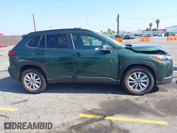 ✅ 2023 Toyota Corolla Cross LE • VIN: 7MUCAAAG3PV042624 • Lot: 42185430. Listed on IAAI with 28,039 mi. Free auction sales archive from the USA and detailed vehicle history report at DreamBid. Image 13.