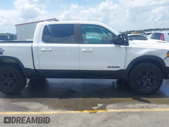 ✅ 2021 Ram 1500 Rebel • VIN: 1C6SRFLTXMN570577 • Lot: 42167696. Listed on IAAI with 114,164 mi. Free auction sales archive from the USA and detailed vehicle history report at DreamBid. Image 13.