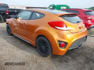 2015 Hyundai Veloster Turbo z VIN KMHTC6AE2FU244523, wystawiony jako IAAI lot #42699013 z przebiegiem 148 262 mil mil oraz . Historia ofert i sprzedaży dostępna na DreamBid. Obrazek 3.
