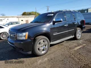 2013 Chevrolet Tahoe LTZ with VIN 1GNSKCE04DR202829, listed as a Copart auction lot 85907885 with 220,314 mi miles and Salvage title. Bid and sale history available at DreamBid. Image 1.