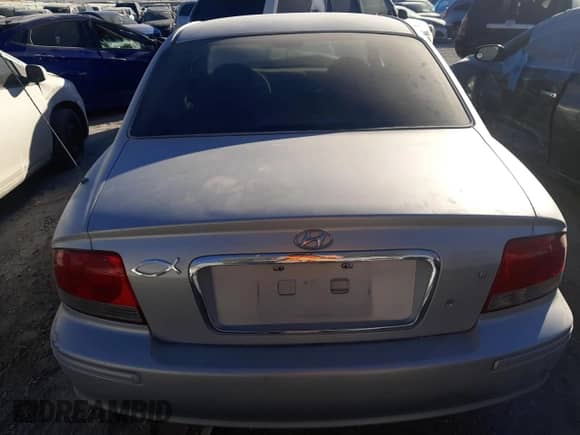 2003 Hyundai Sonata z VIN KMHWF25H93A810837, wystawiony jako Copart lot #87338264 z przebiegiem 73 916 mil mil oraz Nie do naprawy • Non repairable. Historia ofert i sprzedaży dostępna na DreamBid. Obrazek 6.