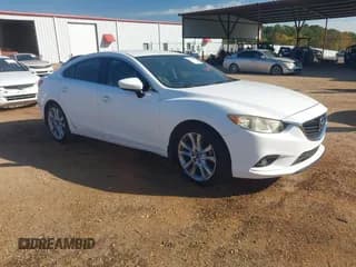 ✅ 2014 Mazda 6 i Touring • VIN: JM1GJ1V65E1157099 • Lot: 43669882. Listed on IAAI with 213,210 mi. Free auction sales archive from the USA and detailed vehicle history report at DreamBid. Image 1.