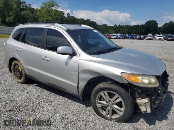 2012 Hyundai Santa Fe SE z VIN 5XYZH4AG0CG097914, wystawiony jako Copart lot #67776104 z przebiegiem 166 992 mil mil oraz Szkoda całkowita • Salvage title. Historia ofert i sprzedaży dostępna na DreamBid. Obrazek 4.